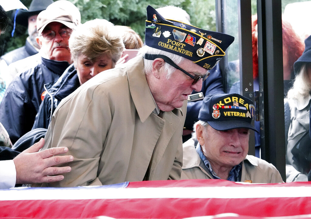 In this Jan. 17, 2019, photo, two elderly veterans were among the last to arrive at a service to bury three Memphis veterans who died this past fall and whose remains were unclaimed in Memphis, Tenn. The veterans were buried at the West Tennessee Veterans Cemetery with honors.