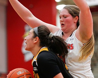YSU's Mary Dunn tries to block Northern Kentucky's Jazmyne Geist during their game in Beeghly Center on Monday afternoon. EMILY MATTHEWS | THE VINDICATOR