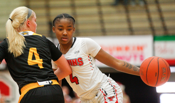 YSU's Deleah Gibson dribbles the ball while Northern Kentucky's Taylor Clos tries to block her during their game in Beeghly Center on Monday afternoon. EMILY MATTHEWS | THE VINDICATOR