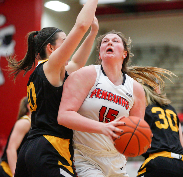 YSU's Mary Dunn looks to the hoop while Northern Kentucky's Grayson Rose, left, tries to block her during their game in Beeghly Center on Monday afternoon. EMILY MATTHEWS | THE VINDICATOR