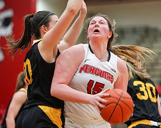 YSU's Mary Dunn looks to the hoop while Northern Kentucky's Grayson Rose, left, tries to block her during their game in Beeghly Center on Monday afternoon. EMILY MATTHEWS | THE VINDICATOR