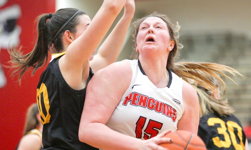 Youngstown State’s Mary Dunn (15) looks to the hoop while Northern Kentucky’s Grayson Rose, left, tries to block her during their game in Beeghly Center on Monday afternoon. The Penguins won, 77-66.
