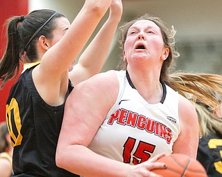 Youngstown State’s Mary Dunn (15) looks to the hoop while Northern Kentucky’s Grayson Rose, left, tries to block her during their game in Beeghly Center on Monday afternoon. The Penguins won, 77-66.