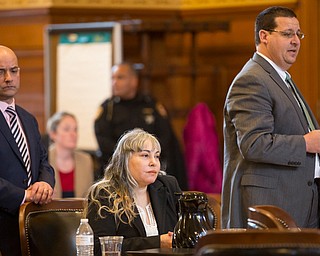 Claudia Hoerig, center, with her attorneys David Rouzzo, left, and John Cornely during her trial on Wednesday. EMILY MATTHEWS | THE VINDICATOR