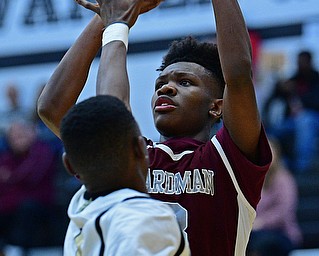 WARREN, OHIO - JANUARY 23, 2019: Boardman's Derrick Anderson puts up a shot over Harding's Dominic Foster during the first half of their game, Wednesday night at Warren Harding High School. DAVID DERMER | THE VINDICATOR