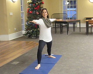 Neighbors | Jessica Harker.Yoga instructor Susan Trimacco ran the weekly yoga class at the Poland library Jan. 2.
