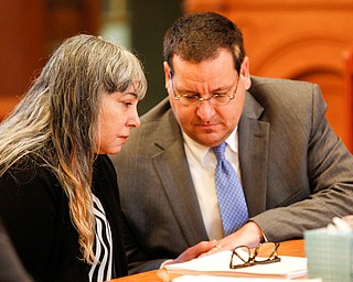 Claudia Hoerig talks to her attorney John Cornely during her trial on Thursday. EMILY MATTHEWS | THE VINDICATOR