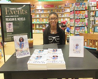 Neighbors | Jessica Harker.Reagan Nevels, an eighth grader at Austintown Middle School, signed copies of her book "Vision Collision" at the Boardman Barnes and Noble Jan. 19.