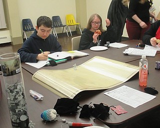 Neighbors | Jessica Harker.Teenagers prepared to continue their Dungeons and Dragons campaign at the Boardman library Jan. 16.