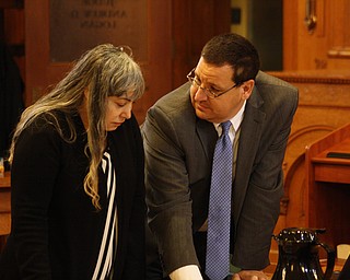 Claudia Hoerig conferred with defense attorney John Cornely this morning prior to the reading of jury instructions in her aggravated murder case.