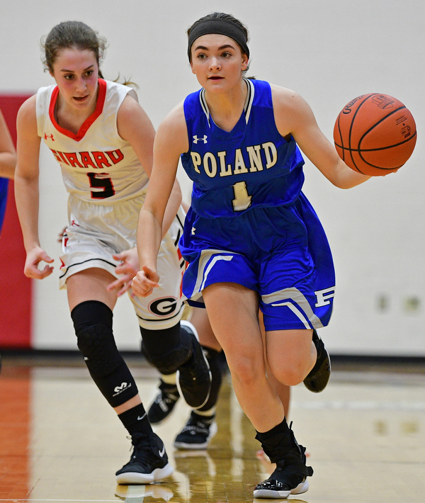GIRARD, OHIO - JANUARY 24, 2019: Poland's Brooke Bobbey dribbles ahead of Girard's Sophie Griffith during the second half of their game, Thursday night at Girard High School. DAVID DERMER | THE VINDICATOR