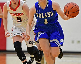 GIRARD, OHIO - JANUARY 24, 2019: Poland's Brooke Bobbey dribbles ahead of Girard's Sophie Griffith during the second half of their game, Thursday night at Girard High School. DAVID DERMER | THE VINDICATOR