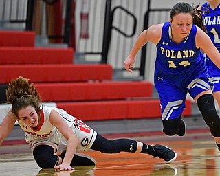 GIRARD, OHIO - JANUARY 24, 2019: Poland's Kailyn Brown dribbles away from Girard's Sophie Griffith after a steal during the second half of their game, Thursday night at Girard High School. DAVID DERMER | THE VINDICATOR
