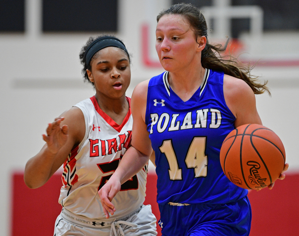 GIRARD, OHIO - JANUARY 24, 2019: Poland's Kailyn Brown drives on Girard's Jalaya Brown during the second half of their game, Thursday night at Girard High School. DAVID DERMER | THE VINDICATOR