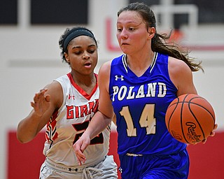 GIRARD, OHIO - JANUARY 24, 2019: Poland's Kailyn Brown drives on Girard's Jalaya Brown during the second half of their game, Thursday night at Girard High School. DAVID DERMER | THE VINDICATOR
