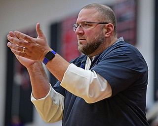 GIRARD, OHIO - JANUARY 24, 2019: Poland head coach Nick Blanch applauds from the bench during the second half of their game, Thursday night at Girard High School. DAVID DERMER | THE VINDICATOR