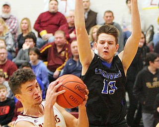 William D. Lewis The Vindicator South Range's Jaxon alexander(23) pulls down a rebound past Lakeview'sCarter Huff(13) during 1-25-19 action at South Range.