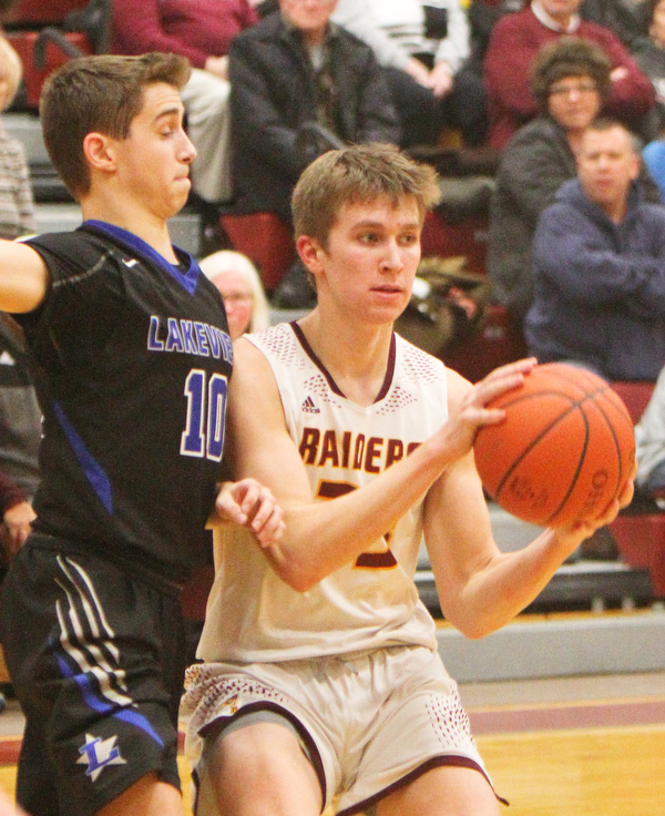 William D. Lewis The Vindicator South Range's Ben Irons(33) keeps the ball from Lakeview'sAJ McClellen(100 during 1-25-19 action at South Range.