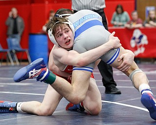 Austintown Fitch's Colin Roberts, left, and Rootstown's Caleb Edwards wrestle during the final round of the Josh Hephner Memorial Wrestling Tournament at Austintown Fitch High School on Saturday. Edwards was the champion in the 113 weight class. EMILY MATTHEWS | THE VINDICATOR