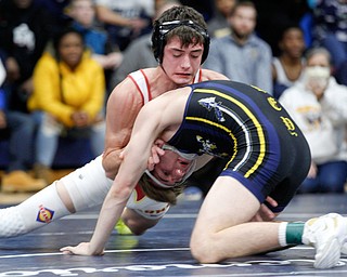 South Range's Kyle Keenan, left, and Copley's Canyon Wells wrestle during the final round of the Josh Hephner Memorial Wrestling Tournament at Austintown Fitch High School on Saturday. Keenan was the champion in the 126 weight class. EMILY MATTHEWS | THE VINDICATOR