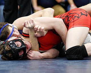 Girard's Alex DelGarbino, front, and Rootstown's Trent Duval wrestle during the final round of the Josh Hephner Memorial Wrestling Tournament at Austintown Fitch High School on Saturday. Duval was the champion in the 132 weight class. EMILY MATTHEWS | THE VINDICATOR