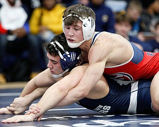 Austintown Fitch's Gus Sutton, top, and Rootstown's Niko Chilson wrestle during the final round of the Josh Hephner Memorial Wrestling Tournament at Austintown Fitch High School on Saturday. Sutton was the champion in the 138 weight class. EMILY MATTHEWS | THE VINDICATOR