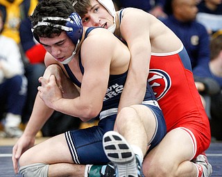 Austintown Fitch's Gus Sutton, right, and Rootstown's Niko Chilson wrestle during the final round of the Josh Hephner Memorial Wrestling Tournament at Austintown Fitch High School on Saturday. Sutton was the champion in the 138 weight class. EMILY MATTHEWS | THE VINDICATOR