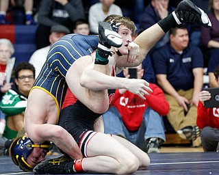 Canfield's David Reinhart, right, and Tallmadge's Richie Eyre wrestle during the final round of the Josh Hephner Memorial Wrestling Tournament at Austintown Fitch High School on Saturday. Reinhart was the champion in the 160 weight class. EMILY MATTHEWS | THE VINDICATOR