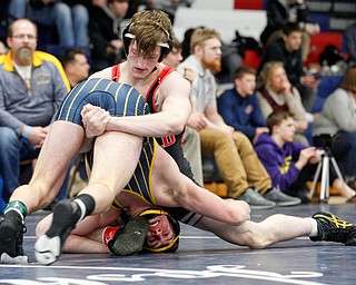 Canfield's David Reinhart, back, and Tallmadge's Richie Eyre wrestle during the final round of the Josh Hephner Memorial Wrestling Tournament at Austintown Fitch High School on Saturday. Reinhart was the champion in the 160 weight class. EMILY MATTHEWS | THE VINDICATOR