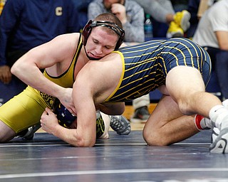 Liberty's Kaleb Merrick-Neff, left, and Tallmadge's Jesse Kanatzar wrestle during the final round of the Josh Hephner Memorial Wrestling Tournament at Austintown Fitch High School on Saturday. Kanatzar was the champion in the 182 weight class. EMILY MATTHEWS | THE VINDICATOR