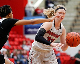 YSU's Sarah Cash dribbles the ball while CSU's Savanna Crockett tries to block her during their game on Saturday in Beeghly Center. EMILY MATTHEWS | THE VINDICATOR