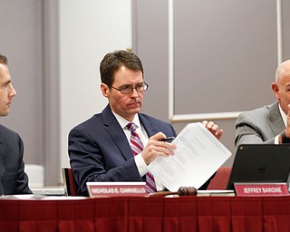 The Boardman school board on Monday approved a realignment plan that closes Market Street Elementary at year’s end. From left are Treasurer Nicholas Ciarniello, board President Jeff Barone and Superintendent Tim Saxton. Robinwood Lane, Stadium Drive and West Boulevard buildings will become K-3 schools to accommodate incoming Market Street students. All fourth-graders will move to Center Intermediate School on Market Street, making Center a 4- to 6-grade building.