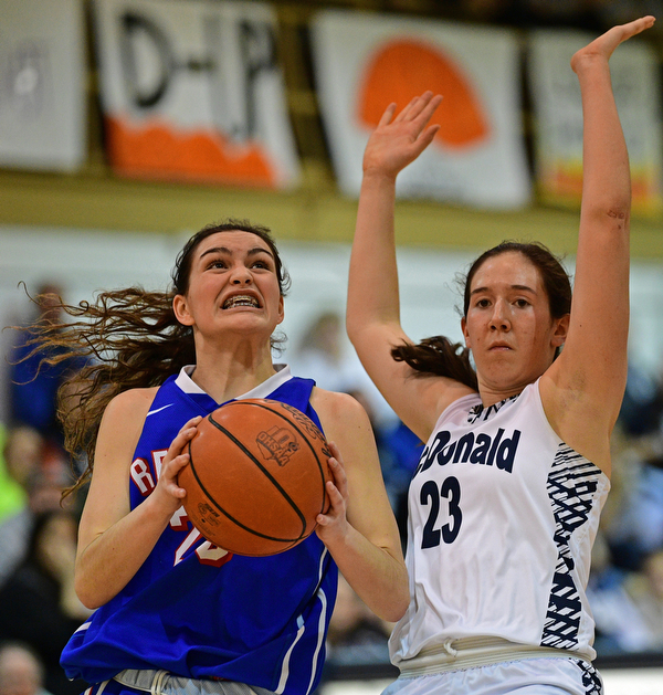 McDONALD, OHIO - JANUARY 28, 2019: Western Reserve's Erica DeZee goes to the basket against McDonald's Sophia Costantino during the first half of their game, Monday night at McDonald High School. McDonald won 56-55 in overtime. DAVID DERMER | THE VINDICATOR