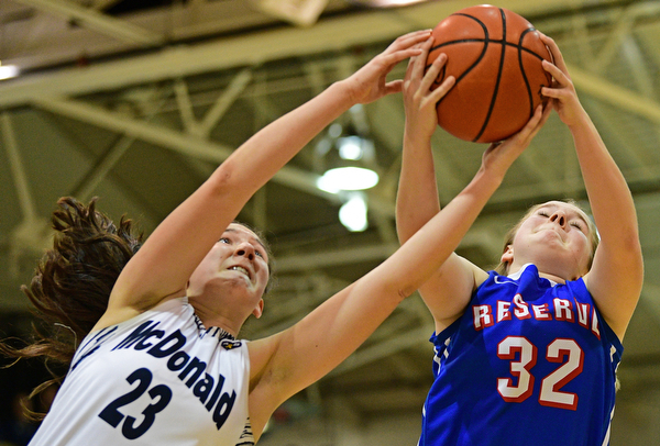 McDONALD, OHIO - JANUARY 28, 2019: Western Reserve's Alyssa Serensky, right, and McDonald's Sophia Costantino reach for a rebound during the second half of their game, Monday night at McDonald High School. McDonald won 56-55 in overtime. DAVID DERMER | THE VINDICATOR