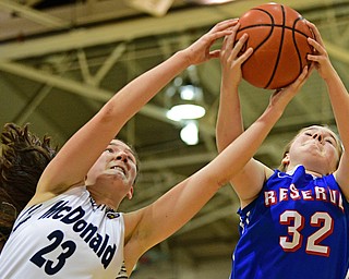 McDONALD, OHIO - JANUARY 28, 2019: Western Reserve's Alyssa Serensky, right, and McDonald's Sophia Costantino reach for a rebound during the second half of their game, Monday night at McDonald High School. McDonald won 56-55 in overtime. DAVID DERMER | THE VINDICATOR