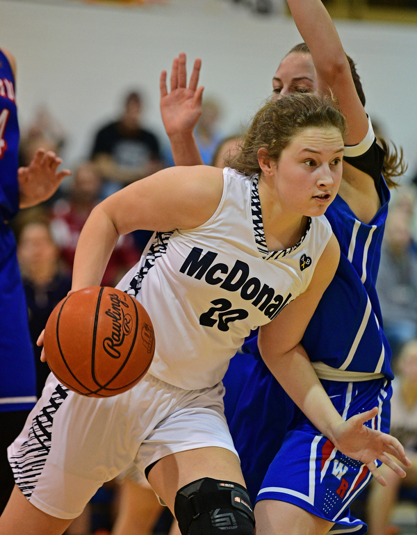 McDONALD, OHIO - JANUARY 28, 2019: McDonald's Molly Howard drives on Western Reserve's Brooke Morris during the second half of their game, Monday night at McDonald High School. McDonald won 56-55 in overtime. DAVID DERMER | THE VINDICATOR