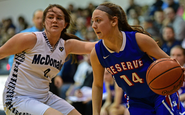 McDONALD, OHIO - JANUARY 28, 2019: Western Reserve's Kennedy Miller drives on McDonald's Taylor Tuchek during the second half of their game, Monday night at McDonald High School. McDonald won 56-55 in overtime. DAVID DERMER | THE VINDICATOR