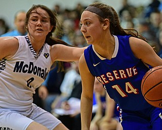 McDONALD, OHIO - JANUARY 28, 2019: Western Reserve's Kennedy Miller drives on McDonald's Taylor Tuchek during the second half of their game, Monday night at McDonald High School. McDonald won 56-55 in overtime. DAVID DERMER | THE VINDICATOR