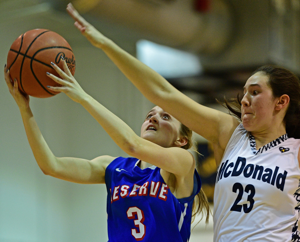 McDONALD, OHIO - JANUARY 28, 2019: Western Reserve's Maddy Owen goes to the basket against McDonald's Sophia Costantino during the second half of their game, Monday night at McDonald High School. McDonald won 56-55 in overtime. DAVID DERMER | THE VINDICATOR