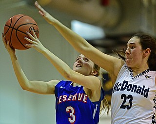 McDONALD, OHIO - JANUARY 28, 2019: Western Reserve's Maddy Owen goes to the basket against McDonald's Sophia Costantino during the second half of their game, Monday night at McDonald High School. McDonald won 56-55 in overtime. DAVID DERMER | THE VINDICATOR