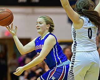 McDONALD, OHIO - JANUARY 28, 2019: Western Reserve's Alyssa Herron attempts to pass while being pressured by McDonald's Taylor Tuchek during the second half of their game, Monday night at McDonald High School. McDonald won 56-55 in overtime. DAVID DERMER | THE VINDICATOR