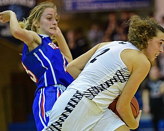 McDONALD, OHIO - JANUARY 28, 2019: McDonald's Olivia Perry goes to the basket after excepting the pressure from Western Reserve's Maddy Owen during the second half of their game, Monday night at McDonald High School. McDonald won 56-55 in overtime. DAVID DERMER | THE VINDICATOR