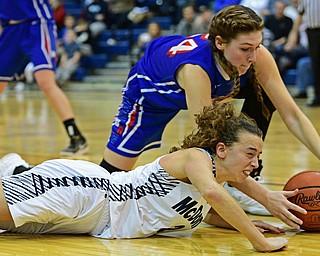 McDONALD, OHIO - JANUARY 28, 2019: McDonald's Olivia Perry and Western Reserve's Danielle Vuletich battle for a loose ball during the second half of their game, Monday night at McDonald High School. McDonald won 56-55 in overtime. DAVID DERMER | THE VINDICATOR