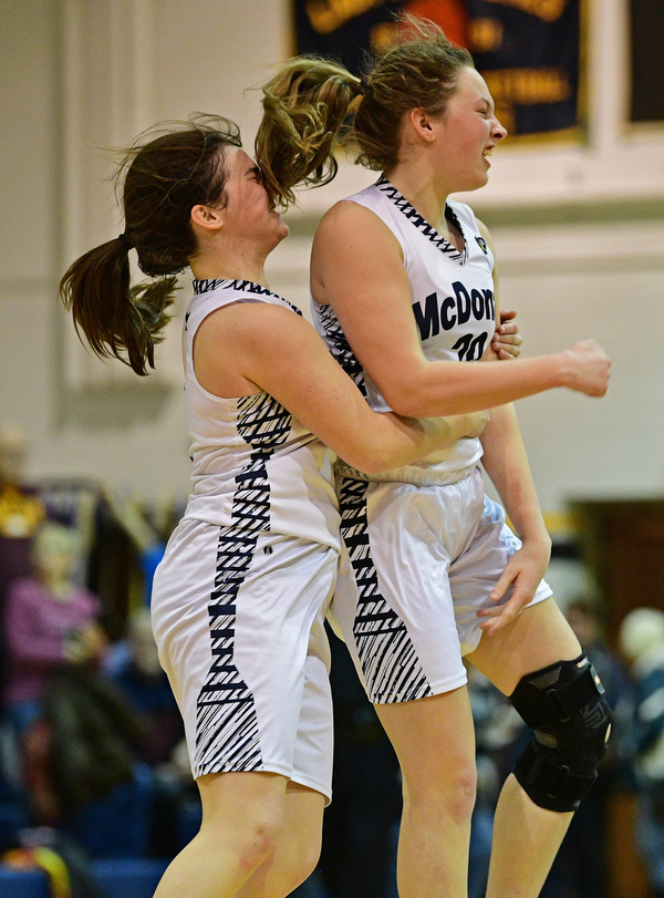 McDONALD, OHIO - JANUARY 28, 2019: McDonald's Molly Howard, right, and Taylor Tuchek celebrates after defeating Western Reserve 56-55 in overtime, Monday night at McDonald High School. DAVID DERMER | THE VINDICATOR