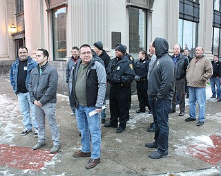 About 30 Warren firefighters and police officers walked the sidewalk from the Warren Police Department to the meeting of Warren Board of Education on Monday night, to ask school officials to apologize to a police officer after an incident Jan. 8 at the Jefferson K-8 School. The officer, Adam Chinchic, was escorted off of school grounds after writing a parking ticket for a school principal. The principal later paid the ticket, and Superintendent Steve Chiaro apologized in an earlier news release.