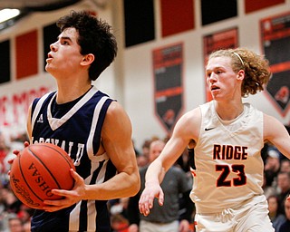 McDonald's Zack Rasile looks towards the hoop during their game against Mineral Ridge at Mineral Ridge on Tuesday night. EMILY MATTHEWS | THE VINDICATOR