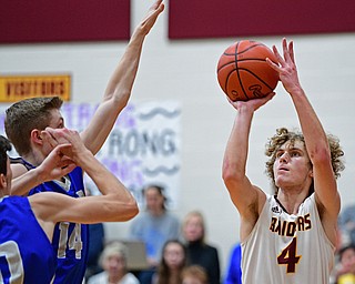 CANFIELD, OHIO - JANUARY 29, 2019: South Range's Brandon Mikos puts up a shot before having it blocked by Poland's Jacob Hyrb during the first half of their game, Tuesday night at South Range High school. DAVID DERMER | THE VINDICATOR