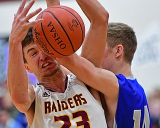 CANFIELD, OHIO - JANUARY 29, 2019: South Range's Jaxon Anderson battles for a loose ball against Poland's Jacob Hyrb during the first half of their game, Tuesday night at South Range High school. DAVID DERMER | THE VINDICATOR