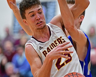 CANFIELD, OHIO - JANUARY 29, 2019: South Range's Jaxon Anderson battles for a loose ball against Poland's Jacob Hyrb during the first half of their game, Tuesday night at South Range High school. DAVID DERMER | THE VINDICATOR