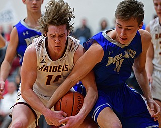 CANFIELD, OHIO - JANUARY 29, 2019: South Range's Dante DiGaetano, left, and Poland's Collin Todd battle for a loose ball during the first half of their game, Tuesday night at South Range High school. DAVID DERMER | THE VINDICATOR